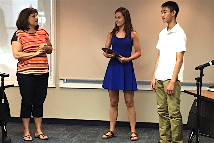 <p>BPS101 Board Member Tina Bleakley (left) presented outgoing Student Ambassador Sam Bradle (middle) with a plaque for her two years of service and introduced BHS sophomore Justin Chu (right) as the newest Student Ambassador to the Board.</p>
