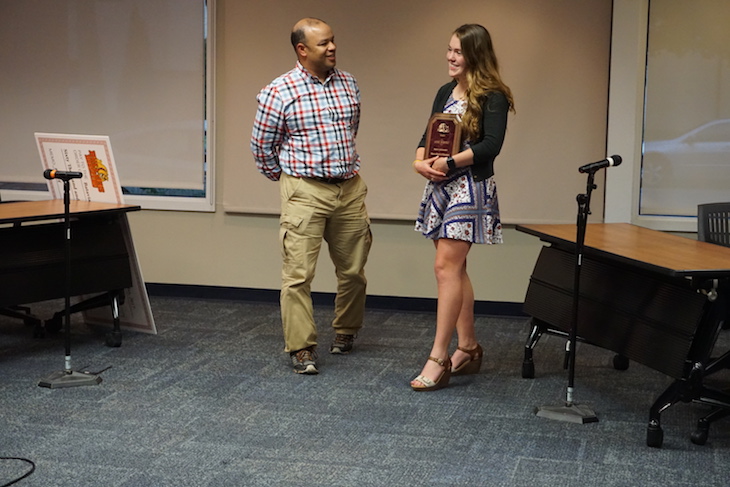 <p>Board Member Chris Lowe presented outgoing Student Ambassador Addie Bobosky with a service award.</p>
