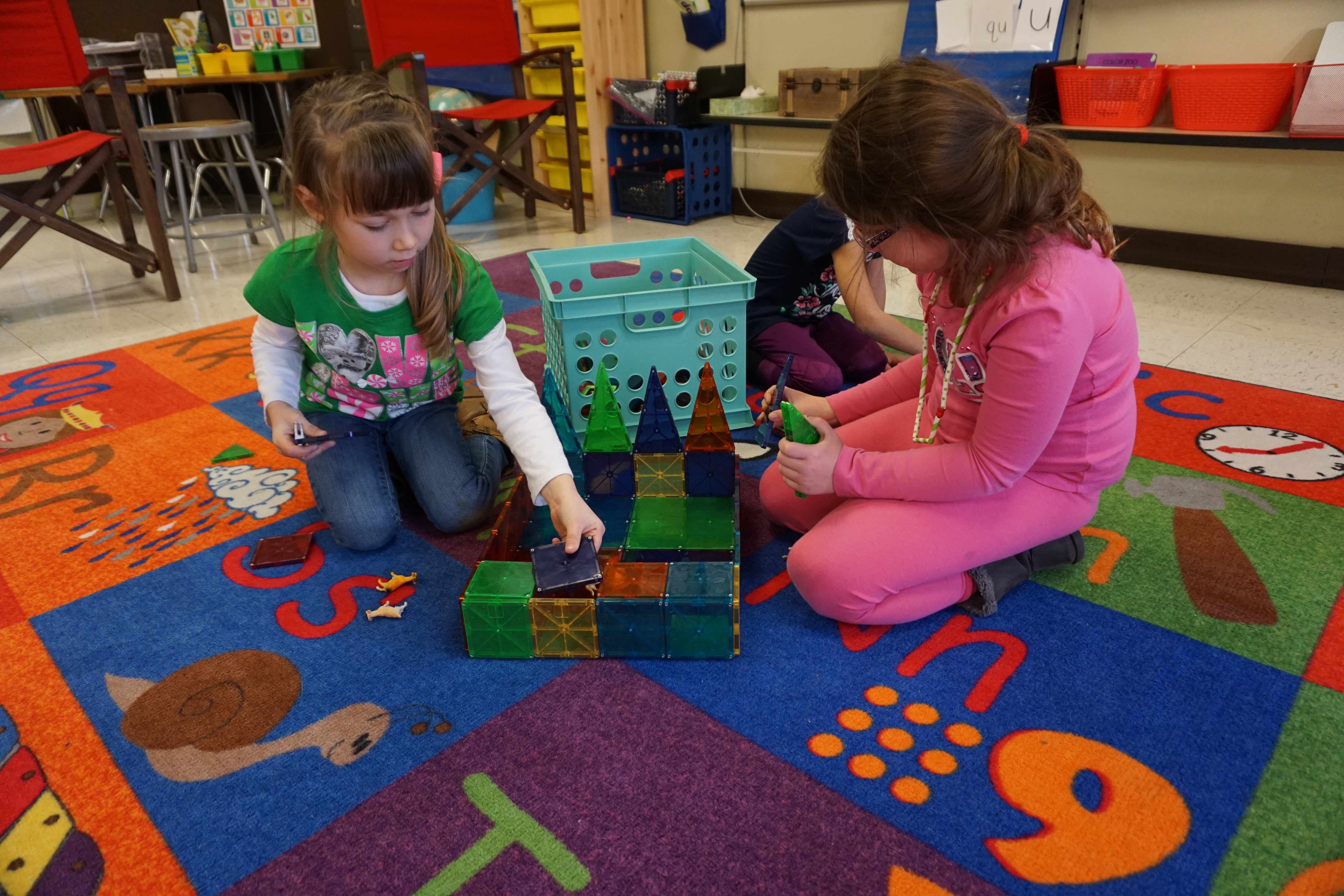 <p>In Missy Beier’s kindergarten class at Louise White School, students use Magna-Tiles to build large structures like this farm with “animal stalls.”</p>

