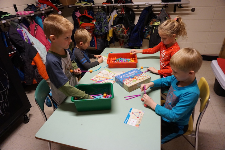 <p>Students in Kristine Scheffert’s kindergarten class at Alice Gustafson School work in stations to explore their new STEM materials.</p>
