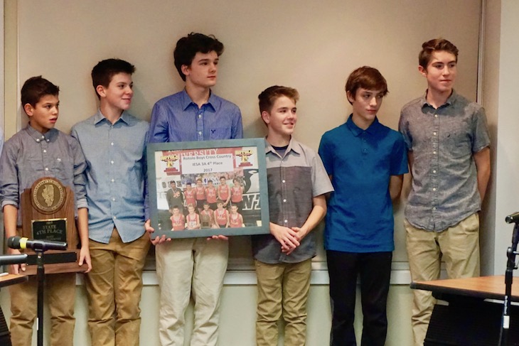 <p>Rotolo Middle School cross country team members presented the Board of Education with a plaque to commemorate their successful 2017 season.</p>
