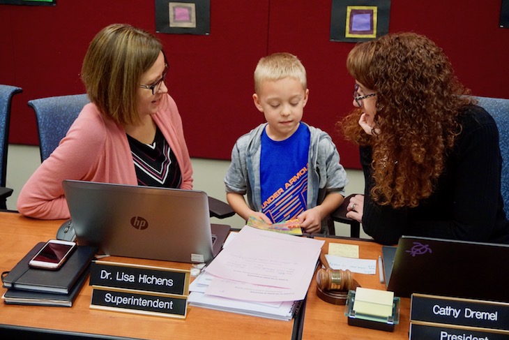 <p>Another H.C. Storm student revealing his reading chops with Superintendent Dr. Lisa Hichens and Board President Cathy Dremel.</p>

