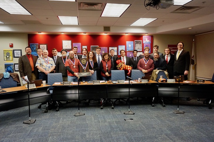 <p>Huddle! During the Batavia Football Team Celebration, players and coaches took time out for a quick photo with the Board. </p>
