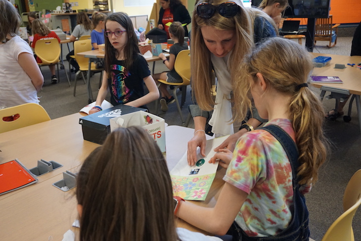 <p>RMS Assistant Principal Nicole Kitzmiller helping a student extract a music maker. Some were a little more difficult than others to remove!</p>
