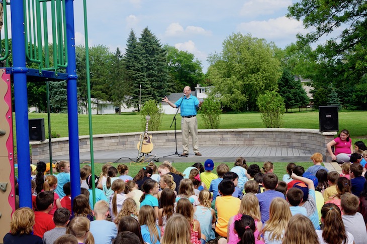 <p>LWS Principal Dr. Kevin Skomer in the new outdoor stage built at LWS in honor of Katie Jonak.</p>
