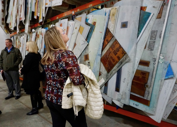 <p>BHS Guidance Counselor Erin Hack taking in BCI’s massive collection of box designs.</p>
