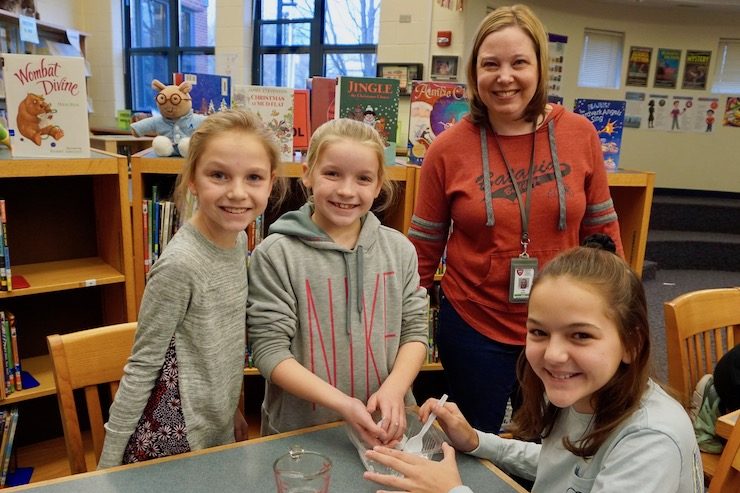 <p>BPS101 Enrichment Coach Julie Brach with a HWS STEM team.</p>
