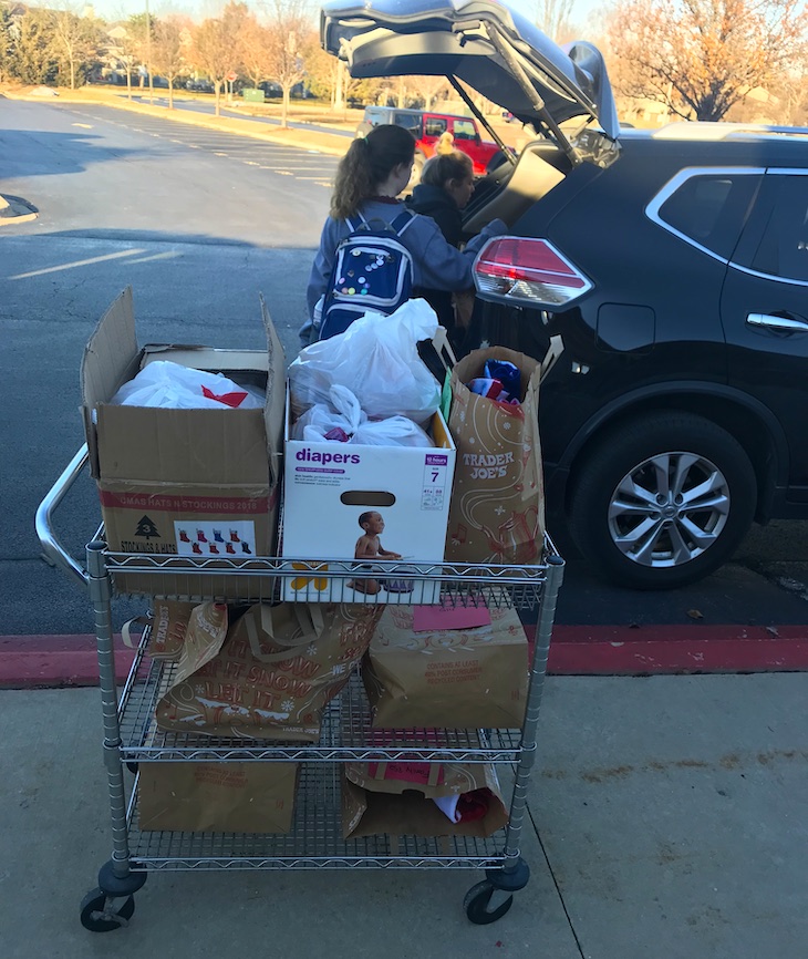 Members of the BHS National Honor Society transporting collected items to Grace McWayne Elementary School for distribution to families.