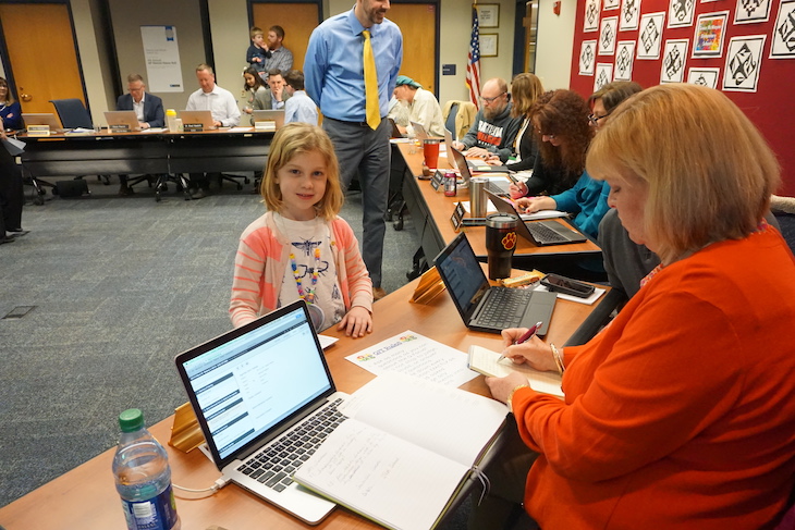 <p>GMS student Lia Stutenberg teaching Board Member Sue Locke how to use QFT.</p>
