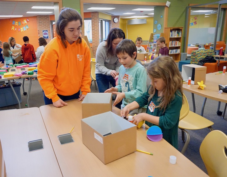 Hey, it's Batavia High School senior Laura Fox helping students with their geoboxes. Laura is interning in Miss Erickson's class at AGS to get teaching experience before she heads off to college in the fall. #101alag