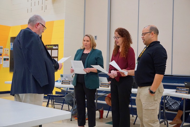 <p>Taking the oath of office (from left): Board Vice President Jon Gaspar, newly elected Board Member Erin Meitzler, and re-elected incumbents Cathy Dremel and Chris Lowe.</p>
