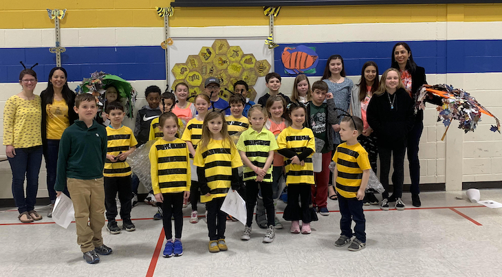 H.C. Storm Green Team members showing fellow students how bees do the "waggle dance."