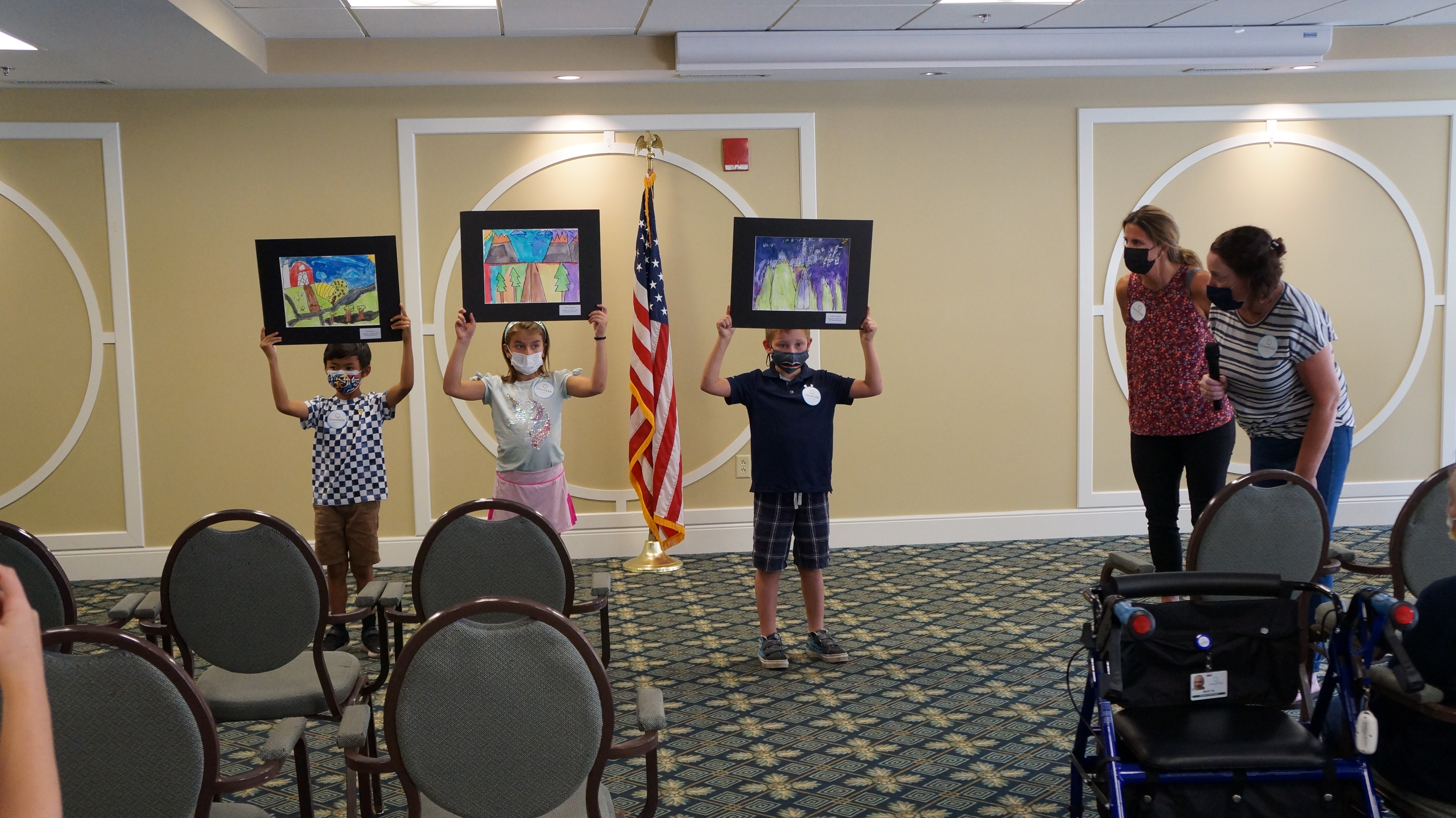 <p>Students proudly showing their work.</p>
