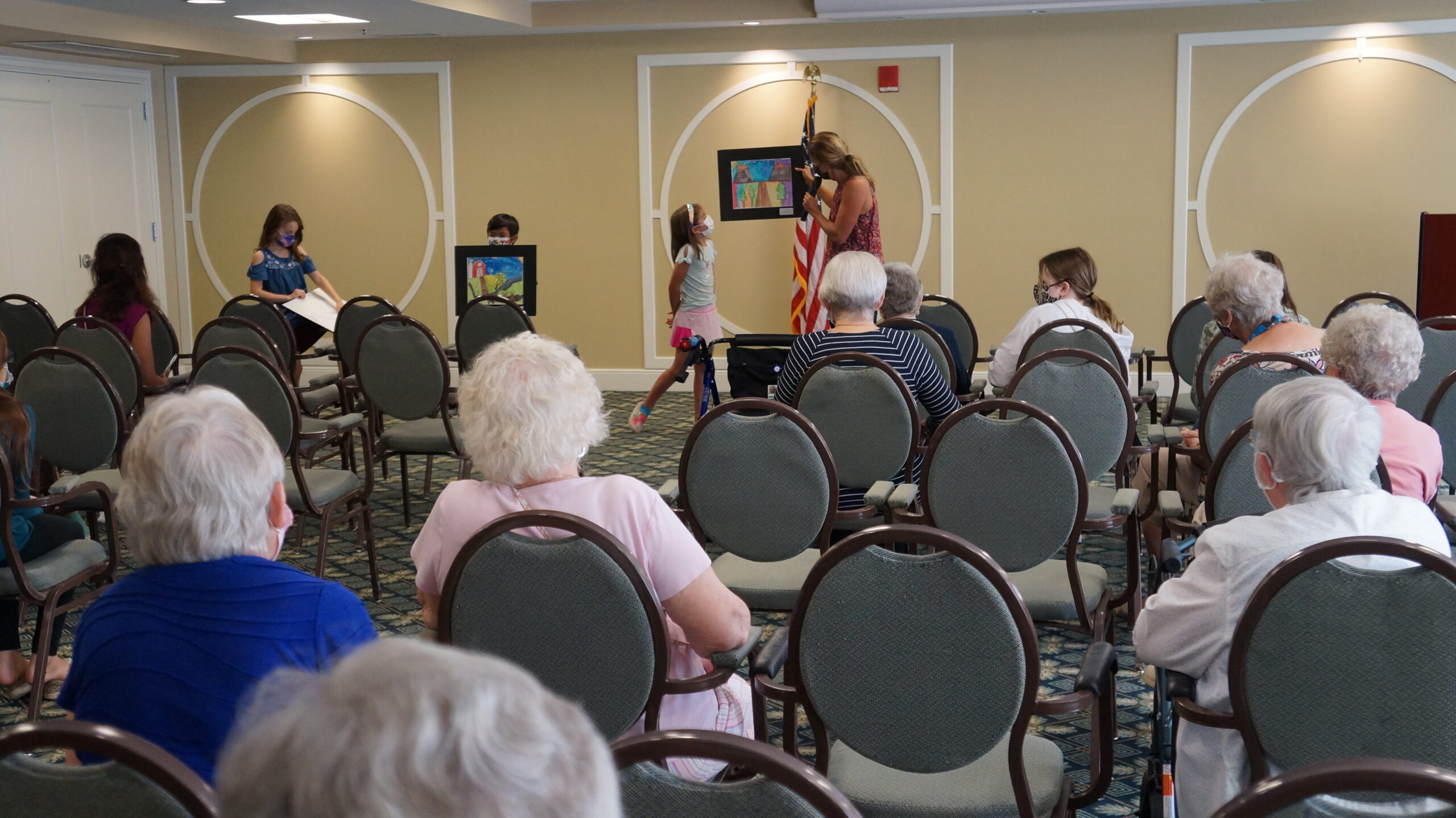 <p>Students proudly showing their work.</p>