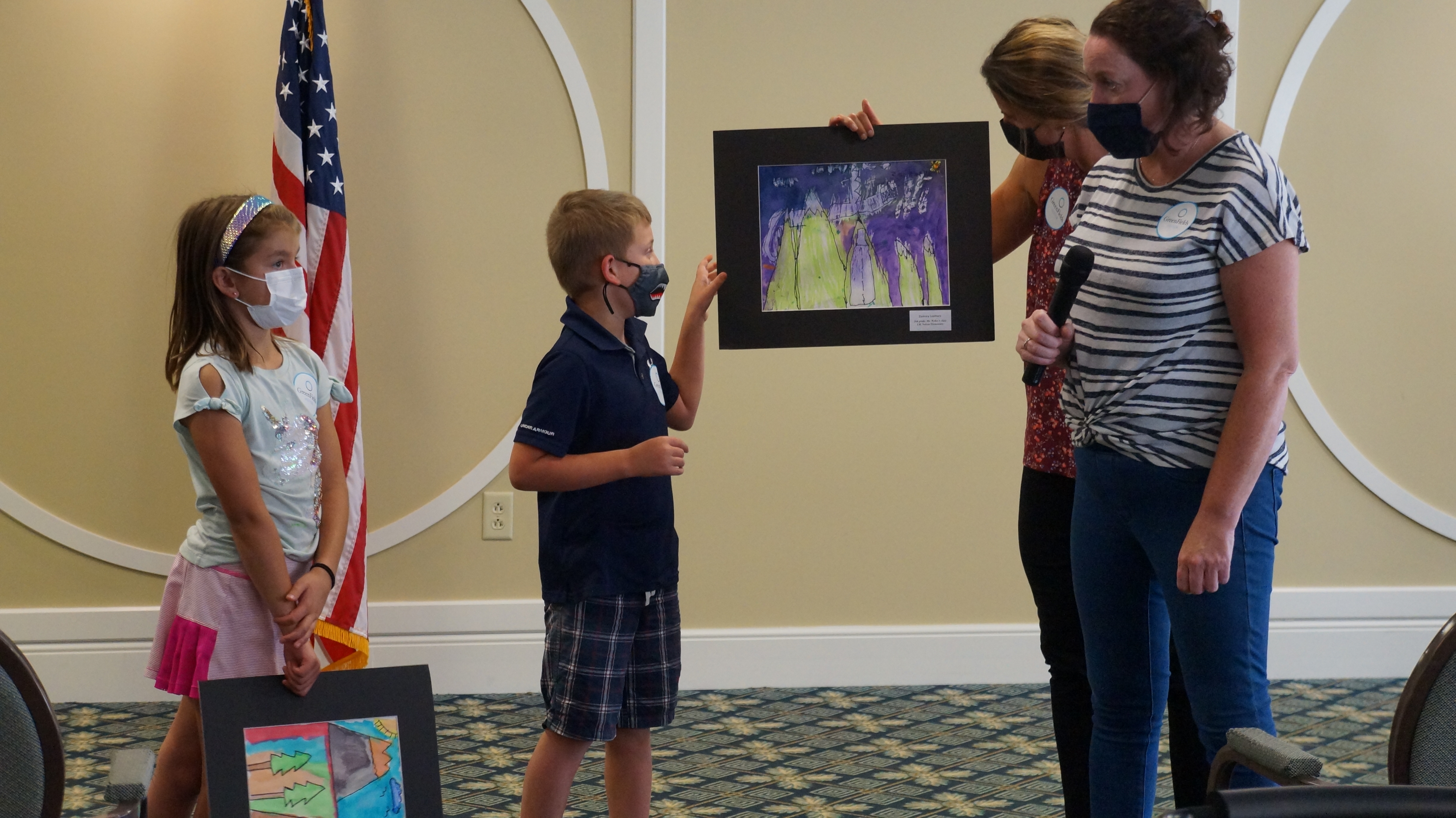 <p>Students proudly showing their work.</p>
