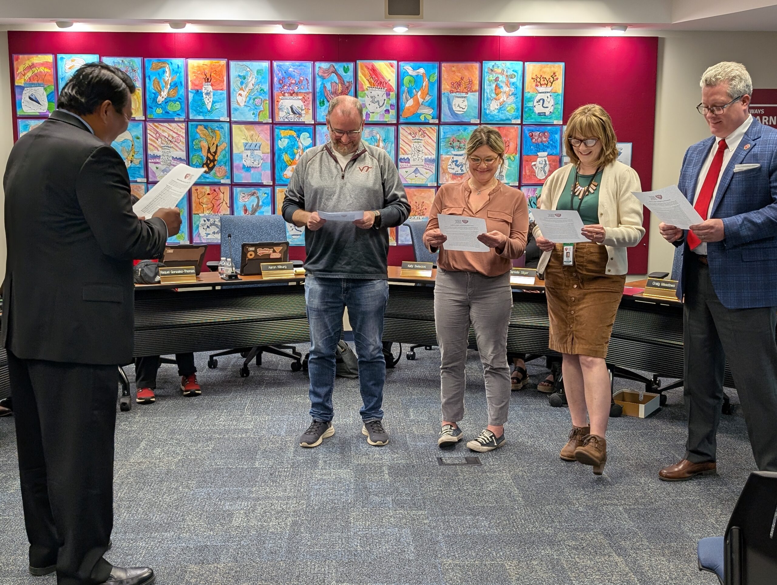 <p>BPS101 Superintendent Tom Kim delivers the oath of office to Craig Meadows, Katy Swiecicki, Kristin Gehrels, and Aaron Kilburg.</p>
