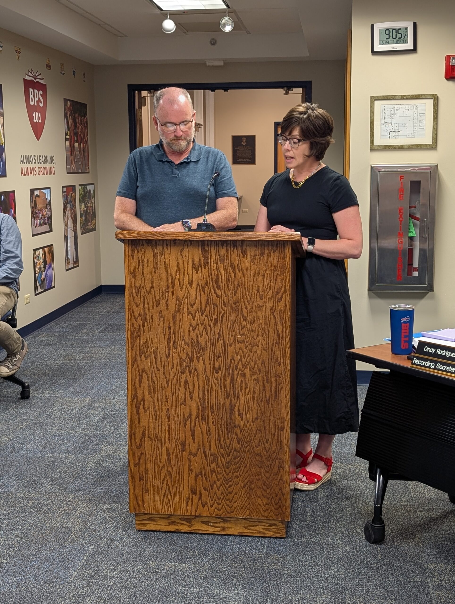 <p>Board President Craig Meadows swears in Tara Gray</p>