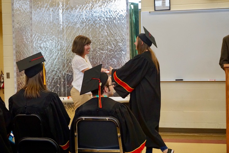 <p>The seniors wore their caps and gowns to Zach’s ceremony.</p>
