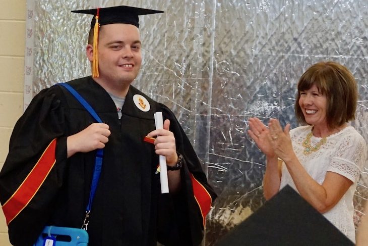 <p>BHS graduate Zachary Hylka receiving his diploma from BPS101 Student Services Director Lisa Palese. Mrs. Palese was one of his teachers in elementary school.</p>
