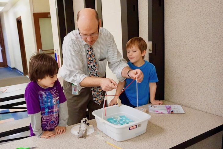 <p>LWS Principal Dr. Kevin Skomer helped students make a zipline to move the gingerbread man from point A to B.</p>
