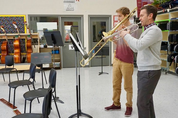 <p>RMS eighth-grader Connor Macauley warming up with RMS Band Director Keith Ozsvath prior to Connor’s two trombone performances of the morning.</p>
